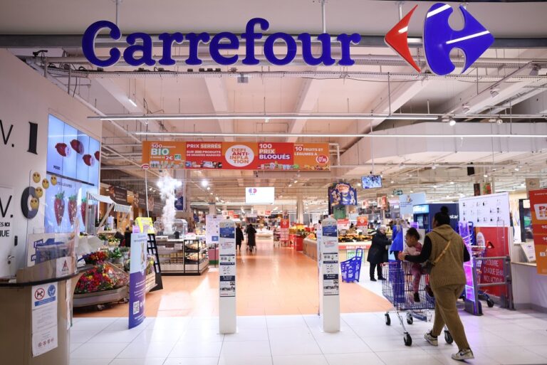 The entrance of Carrefour hypermarket is pictured on March 29, 2023, in Villeneuve-la-Garenne. (Photo by Thomas SAMSON / AFP)